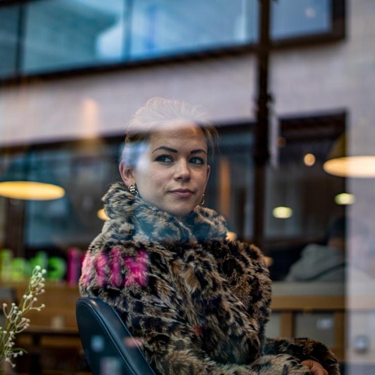 Amara Singh, Lead Design Curator at Mossy Frontier Lab, reviewing corporate floral arrangements